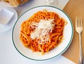Italian spaghetti bolognese served with grated Parmesan