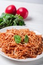 Italian spaghetti with a bolognese tomato meat sauce and basil in a plate. Royalty Free Stock Photo