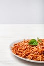 Italian spaghetti with a bolognese tomato meat sauce and basil in a plate. Royalty Free Stock Photo