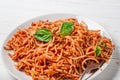 Italian spaghetti with a bolognese tomato meat sauce and basil in a plate. Royalty Free Stock Photo
