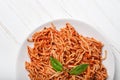 Italian spaghetti with a bolognese tomato meat sauce and basil in a plate. Royalty Free Stock Photo