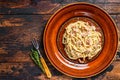 Italian Spaghetti Carbonara pasta with bacon, hard parmesan cheese and cream sauce. Dark Wooden background. top view Royalty Free Stock Photo