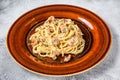 Italian Spaghetti Carbonara pasta with bacon, hard parmesan cheese and cream sauce. White background. top view Royalty Free Stock Photo