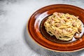 Italian Spaghetti Carbonara pasta with bacon, hard parmesan cheese and cream sauce. White background. top view. Copy Royalty Free Stock Photo
