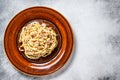 Italian Spaghetti Carbonara pasta with bacon, hard parmesan cheese and cream sauce. White background. top view. Copy Royalty Free Stock Photo