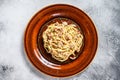 Italian Spaghetti Carbonara pasta with bacon, hard parmesan cheese and cream sauce. White background. top view Royalty Free Stock Photo