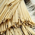 Italian spaghetti lying on sackcloth Royalty Free Stock Photo