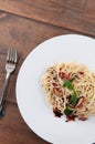 Italian Spaghetti pasta bacon with dried spicy chilli on white p Royalty Free Stock Photo