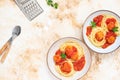 Italian spaghetti pasta with meat balls and tomato sauce served with oregano in two bowls on a light marble table. Top view, copy Royalty Free Stock Photo