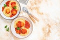Italian spaghetti pasta with meat balls and tomato sauce served with oregano in two bowls on a light marble table. Top view, copy Royalty Free Stock Photo