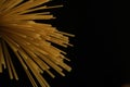 Italian spaghetti raw pasta, dark background