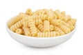 Italian spiral shaped pasta, Fusilli bucati macaroni in ceramic bowl, isolated on white background Royalty Free Stock Photo