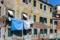 Italian street with clothes and sheets hanging out to dry Royalty Free Stock Photo