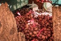 Italian street food. Chestnuts in net bags during the fair in Montella, a town in Campania. Chestnut Festival. Close-up photograph