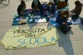 Italian students protest against the government`s choice to close schools by following remote lessons on the sidewalk