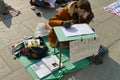 Italian students protest against the government`s choice to close schools by following remote lessons on the sidewalk