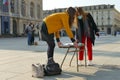 Italian students protest against the government`s choice to close schools by following remote lessons on the sidewalk