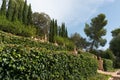 Italian style Mediterranean garden. Stone statues surrounded by vegetation. Mallorca, Spain. Royalty Free Stock Photo