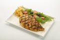 Italian style marinated chicken breast with fresh salads and tomato catchup on white rectangle