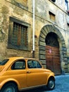 Italian style, Fiat 500 Cinquecento, vintage door and arch, art and history in Viterbo city, Italy Royalty Free Stock Photo