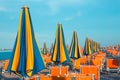Italian summer on the Adriatic Sea: tyipical italian Riviera Romagnola beach clubs with sunbeds and beach umbrellas with typical