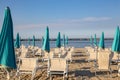 Italian summer on the Adriatic Sea: tyipical italian Riviera Romagnola beach clubs with sunbeds and beach umbrellas with typical