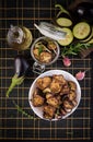 Italian sun-dried eggplant on a dark table. Preserved food.