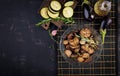 Italian sun-dried eggplant on a dark table. Preserved food.