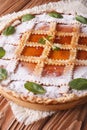 Italian tart with apricot jam and mint close up vertical Royalty Free Stock Photo