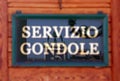 Italian text that means gondola service with the reflection in V