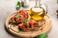 Italian tomato bruschetta with basil, garlic and olive oil on grilled or toasted crusty ciabatta bread, banner, menu Royalty Free Stock Photo