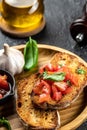 Italian tomato bruschetta with basil, garlic and olive oil on grilled or toasted crusty ciabatta bread, top view Royalty Free Stock Photo