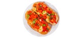Italian tomato bruschetta with chopped vegetables, herbs, cheese and oil on grilled or toasted crusty ciabatta bread. top view. is Royalty Free Stock Photo