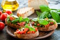 Italian tomato bruschetta with chopped vegetables Royalty Free Stock Photo