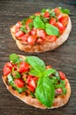 Italian tomato bruschetta with chopped vegetables Royalty Free Stock Photo