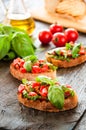 Italian tomato bruschetta with chopped vegetables Royalty Free Stock Photo