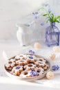 Italian traditional cookies are canestrelli on a white background with flowers. Homemade pastries. The concept of Royalty Free Stock Photo