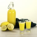 Italian traditional liqueur limoncello with lemon Royalty Free Stock Photo