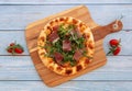 Italian traditional Parma Ham Pizza isolated on wooden table Italian popular food. Top view Pizza