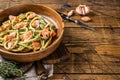 Italian traditional Pasta al Salmone, Bucatini pasta with Smoked Salmon. Wooden background. Top view. Copy space Royalty Free Stock Photo