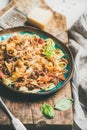 Italian traditional pasta dinner with tagliatelle bolognese and tomato sauce Royalty Free Stock Photo