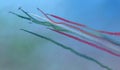 Planes jet of Italian tricolor arrows in acrobatic team during air show, in a spectacular acrobatics Royalty Free Stock Photo