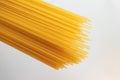 Italian uncooked spaghetti isolated on white background, top view. Texture of pasta viewed from above, Royalty Free Stock Photo