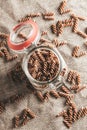 Italian unprepared pasta in a glass jar in the kitchen - fusilli