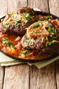 Italian veal steak Ossobuco alla milanese with spicy sauce close