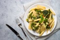 Italian vegetarian pasta penne with green vegetables.