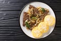 Italian Venetian food beef liver with onion and sage, served with polenta close-up in a plate. horizontal top view Royalty Free Stock Photo