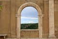 Italian view through the arch window in Sorano, Tuscany, Italy. Royalty Free Stock Photo