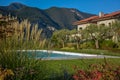 Italian villa with pool, view from the garden. Royalty Free Stock Photo