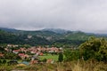 an Italian village in the countryside, with red roofs and green hills all around Royalty Free Stock Photo